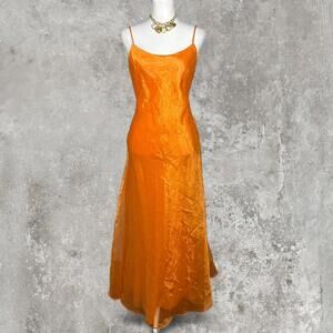 orange gunne sax dress with split in the back and a beaded back strap